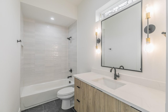 full bathroom featuring tile patterned flooring, vanity, bathing tub / shower combination, and toilet