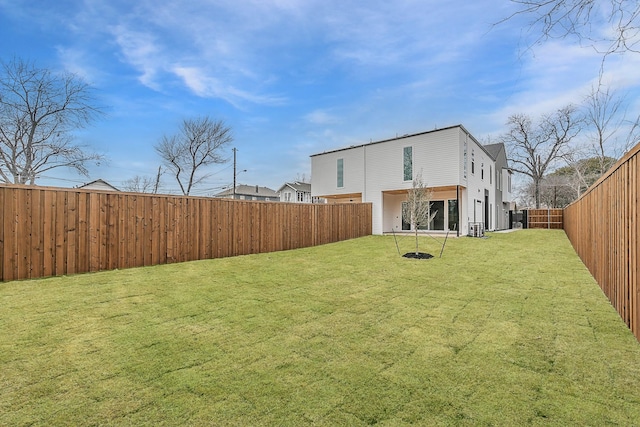 back of house with a lawn