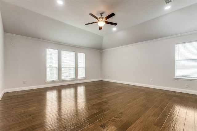 unfurnished room with vaulted ceiling, ornamental molding, dark hardwood / wood-style floors, and ceiling fan