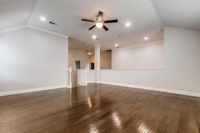 unfurnished room featuring ornamental molding, lofted ceiling, and dark hardwood / wood-style flooring