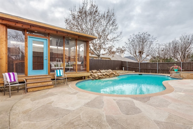 view of swimming pool featuring a patio area