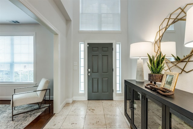 entryway featuring light tile patterned flooring