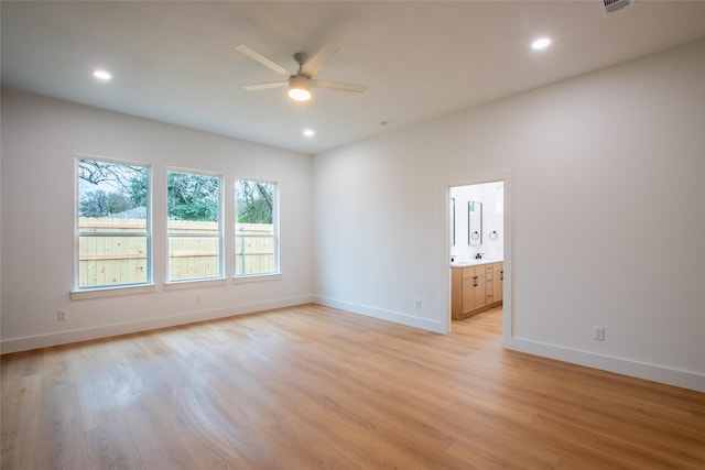 spare room with ceiling fan and light hardwood / wood-style floors