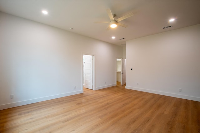 spare room featuring ceiling fan and light hardwood / wood-style flooring