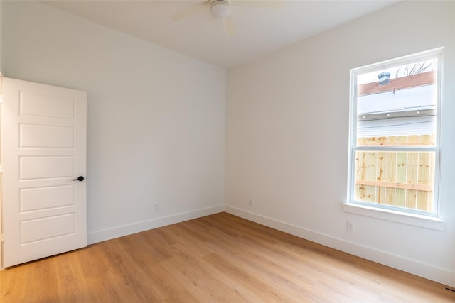 spare room with light hardwood / wood-style floors and ceiling fan