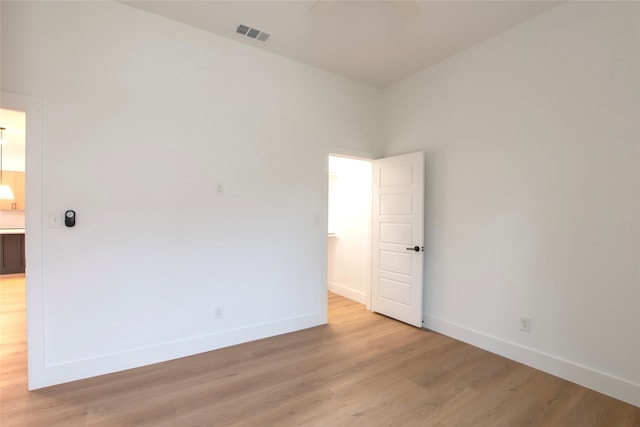 unfurnished room with light hardwood / wood-style floors