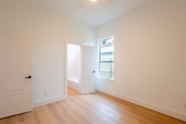 unfurnished bedroom featuring ceiling fan and light wood-type flooring