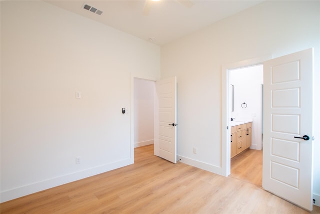 unfurnished bedroom featuring light wood-type flooring