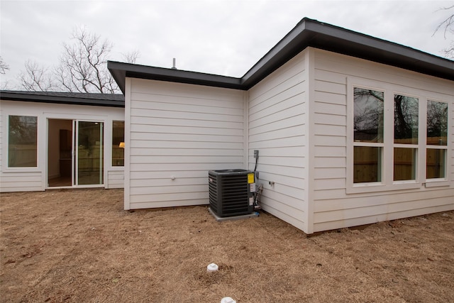 view of property exterior with cooling unit