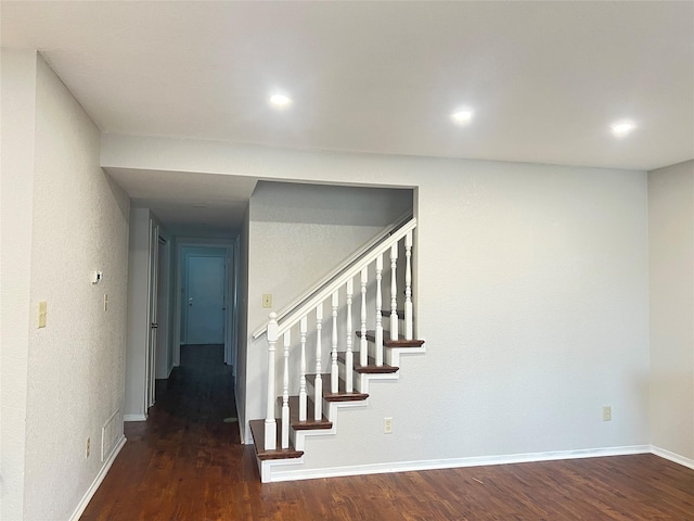 stairs with wood-type flooring