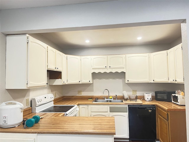 kitchen featuring sink, black appliances, and white cabinets