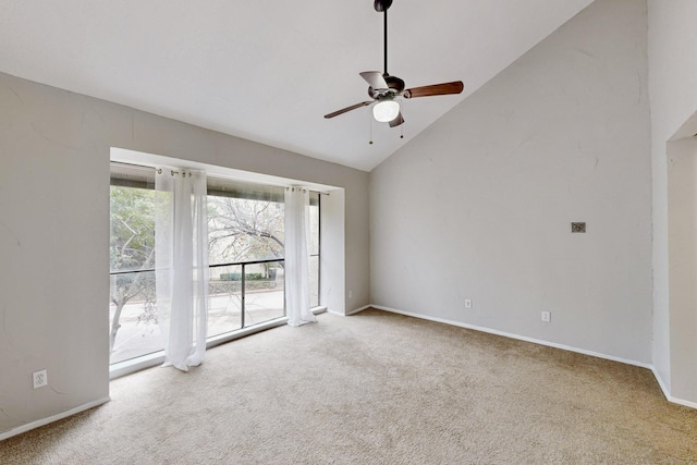 carpeted empty room with high vaulted ceiling and ceiling fan