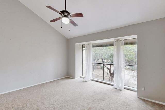 unfurnished bedroom with ensuite bathroom, high vaulted ceiling, light colored carpet, and ceiling fan