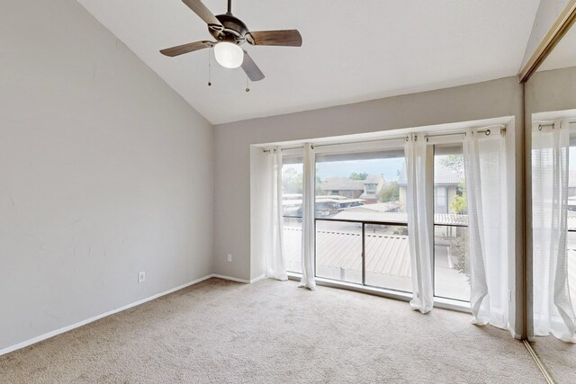 interior space with a closet, ceiling fan, vaulted ceiling, and multiple windows