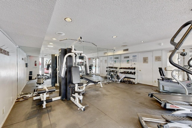 gym featuring a textured ceiling