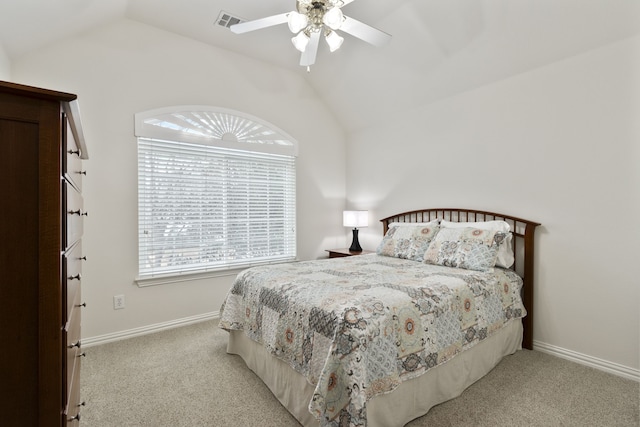 carpeted bedroom featuring lofted ceiling and ceiling fan