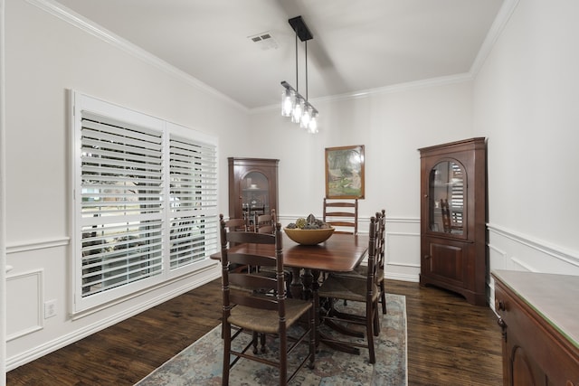 dining space with crown molding and dark hardwood / wood-style floors