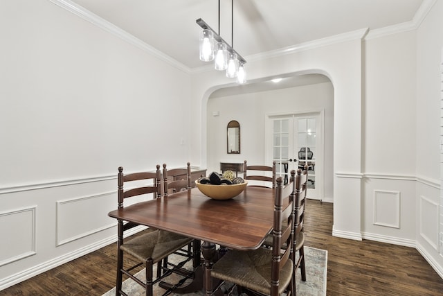 dining room featuring ornamental molding, dark hardwood / wood-style flooring, and french doors