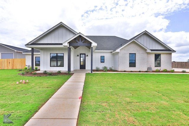 modern farmhouse with a front lawn