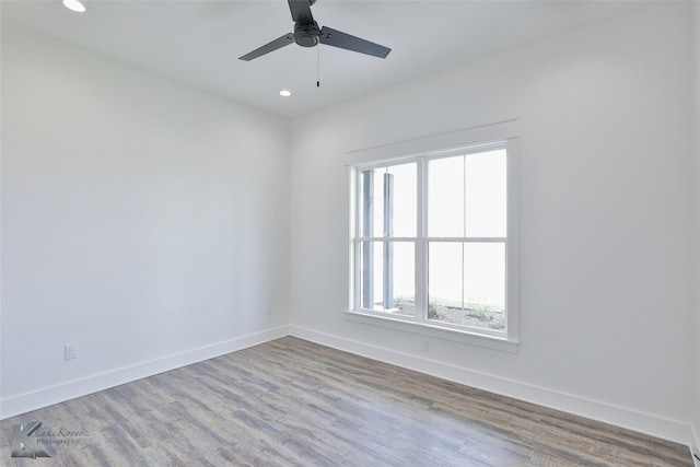 unfurnished room featuring ceiling fan and light hardwood / wood-style flooring