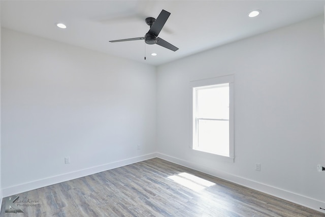 unfurnished room with ceiling fan and light hardwood / wood-style flooring