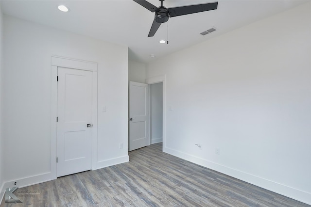 unfurnished bedroom with hardwood / wood-style flooring and ceiling fan