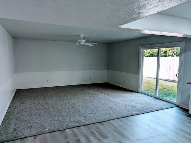 empty room with wood-type flooring and ceiling fan