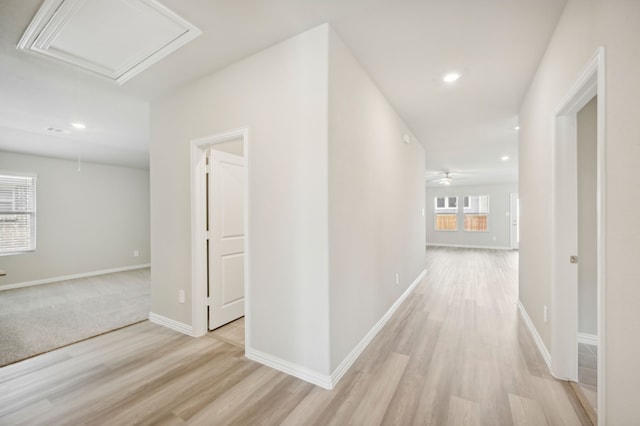 hallway with light wood-type flooring