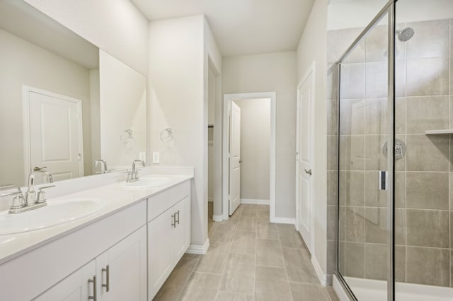 bathroom featuring walk in shower and vanity