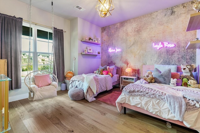 bedroom featuring wood-type flooring