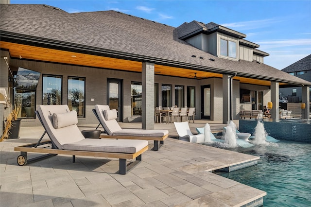 back of house featuring pool water feature, ceiling fan, and a patio