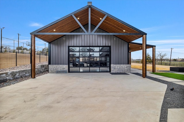 exterior space with a garage and an outdoor structure