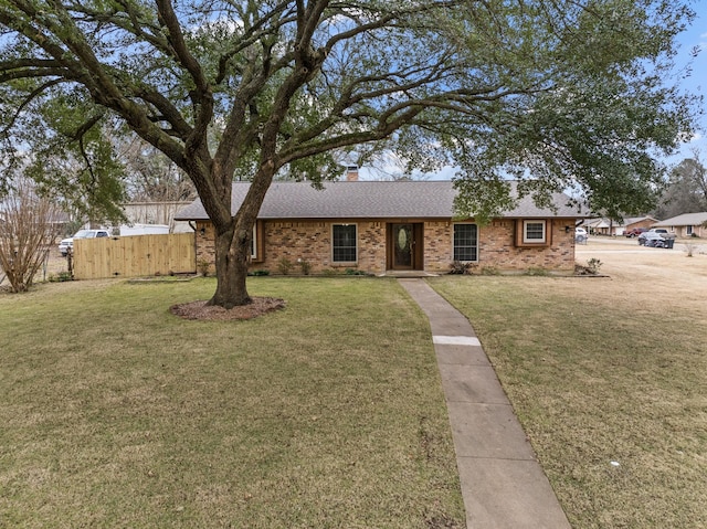 single story home with a front yard