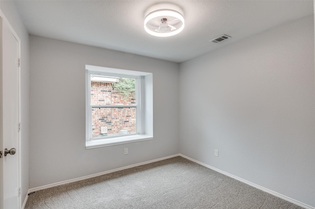 unfurnished room featuring carpet floors