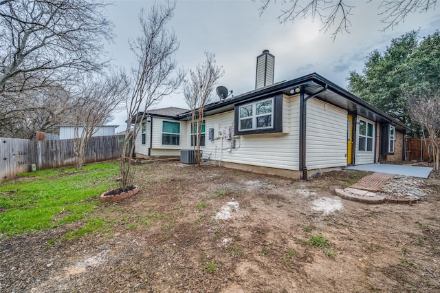 back of house featuring a patio and central air condition unit