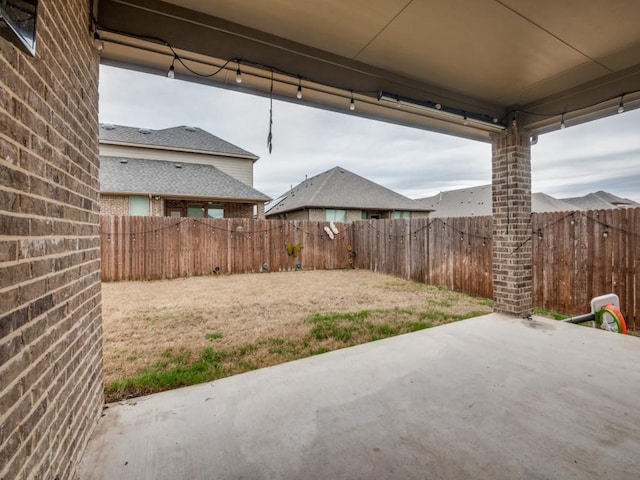 view of yard featuring a fenced backyard and a patio