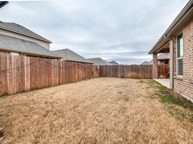 view of yard featuring a fenced backyard