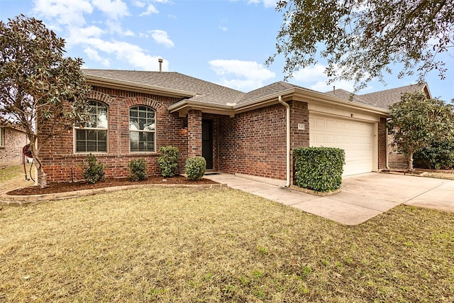 ranch-style home with an attached garage, a shingled roof, a front lawn, concrete driveway, and brick siding