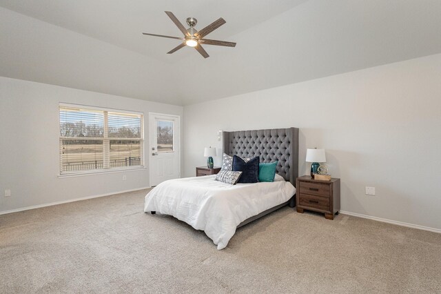 bedroom featuring vaulted ceiling, carpet floors, and ceiling fan