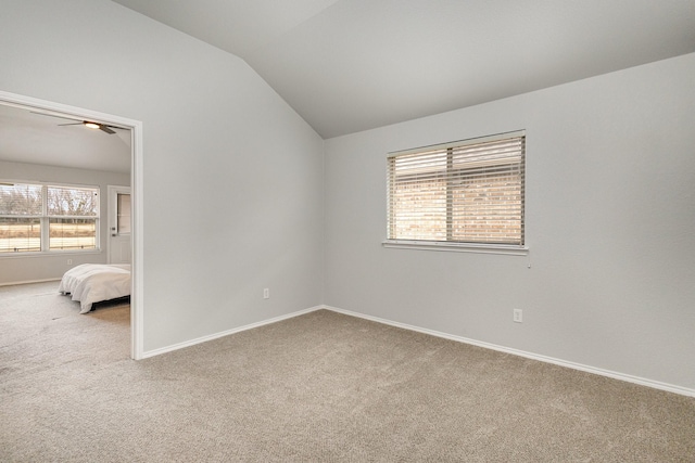 interior space featuring lofted ceiling and ceiling fan