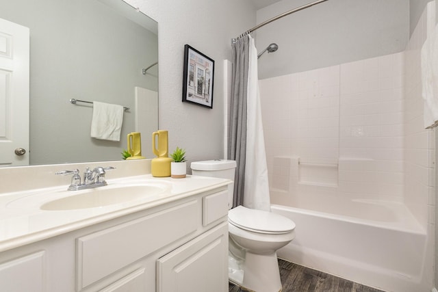 full bathroom with hardwood / wood-style flooring, vanity, toilet, and shower / bath combo with shower curtain