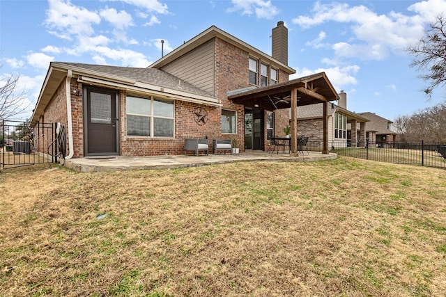 rear view of property with central air condition unit, a patio area, and a lawn