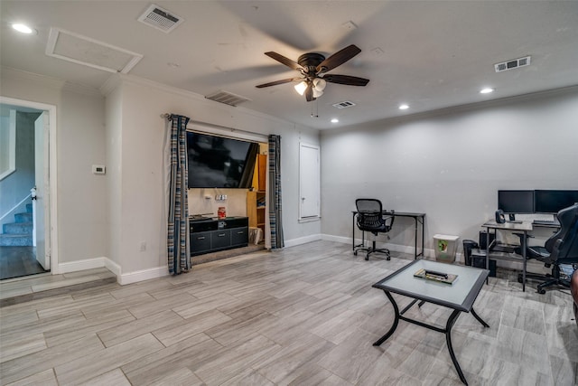 interior space with ornamental molding and ceiling fan