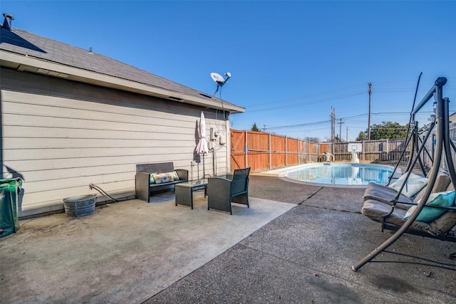 view of patio featuring a fenced in pool