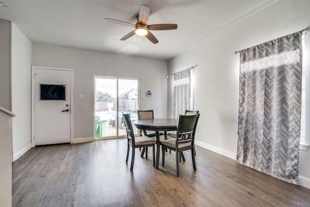 dining space featuring ceiling fan and wood-type flooring