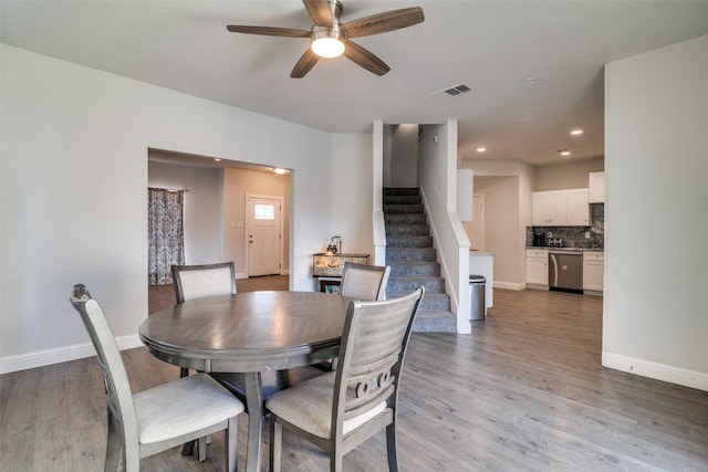 dining area featuring hardwood / wood-style flooring and ceiling fan