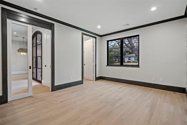 unfurnished bedroom with visible vents, baseboards, light wood-style floors, ornamental molding, and recessed lighting