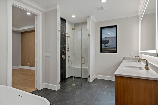 bathroom with plus walk in shower, vanity, and crown molding