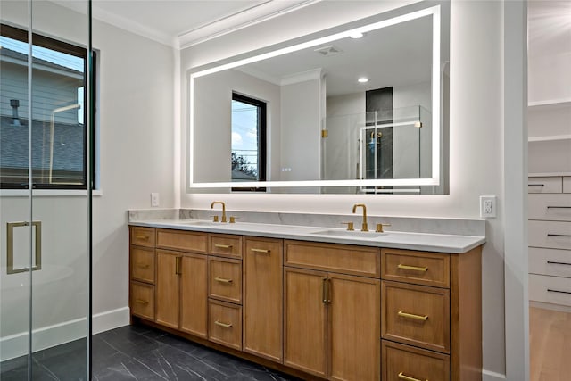 bathroom featuring vanity, an enclosed shower, and ornamental molding