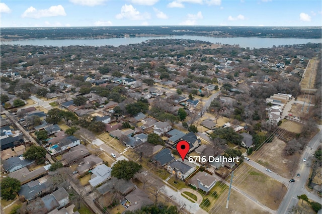bird's eye view with a water view and a residential view